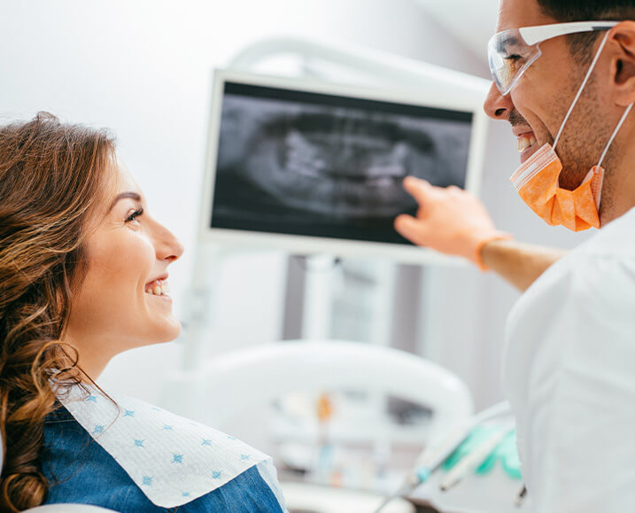 dentist explaining an x-ray to a patient