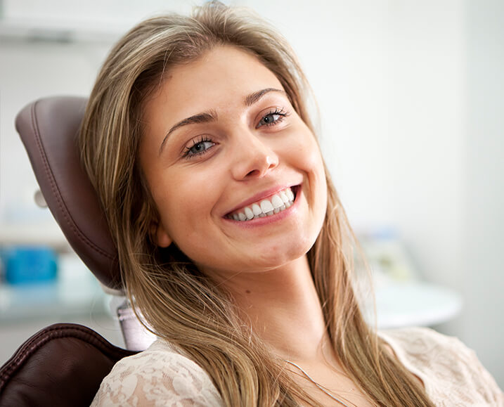 smiling woman sitting in a dental chair